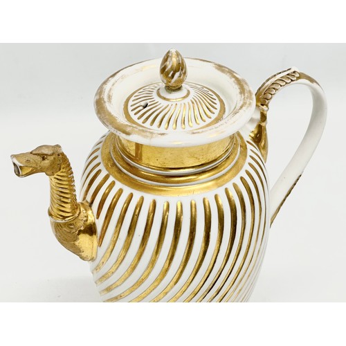 9 - Paris Porcelain. A large Early 19th Century French Empire gilt coffee pot. Circa 1810-1830. 23x28cm.... 