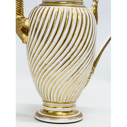 9 - Paris Porcelain. A large Early 19th Century French Empire gilt coffee pot. Circa 1810-1830. 23x28cm