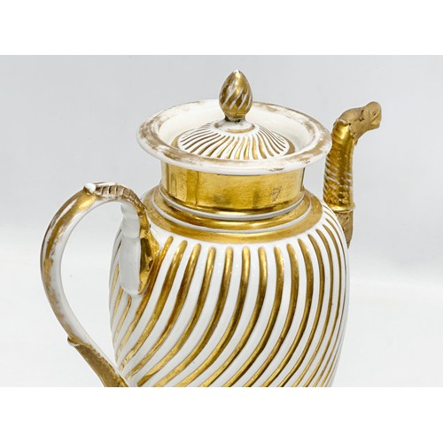 9 - Paris Porcelain. A large Early 19th Century French Empire gilt coffee pot. Circa 1810-1830. 23x28cm.... 