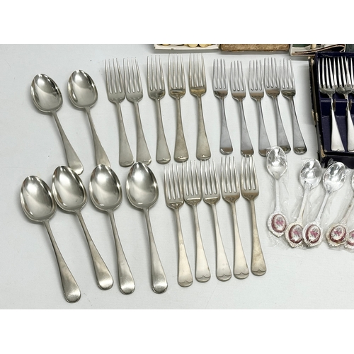 841 - A collection of silver plated cutlery and an Capodimonte miniature flower basket. Including vintage ... 