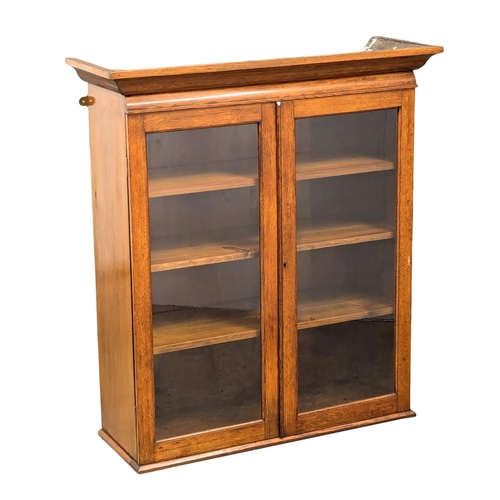 929 - A Late 19th/Early 20th oak hanging bookcase / bookcase top. Circa 1900. 99x34x110cm(2)