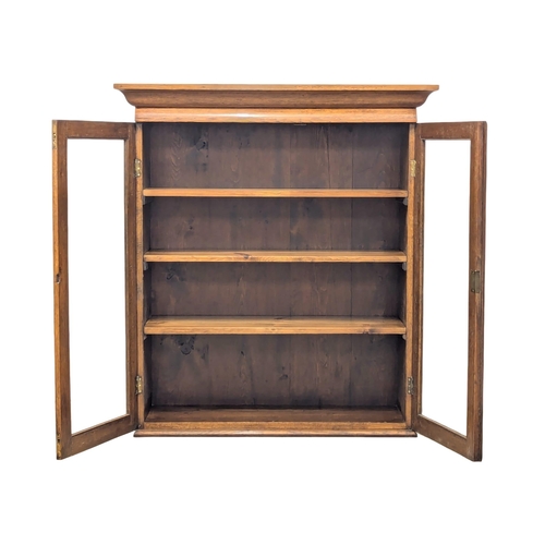 929 - A Late 19th/Early 20th oak hanging bookcase / bookcase top. Circa 1900. 99x34x110cm(2)