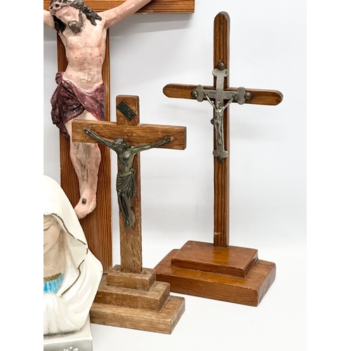 403 - A quantity of Early 20th Century tabletop and wall hanging crucifix’s. With later Madonna figures. P... 