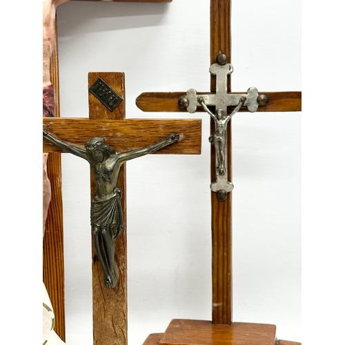 403 - A quantity of Early 20th Century tabletop and wall hanging crucifix’s. With later Madonna figures. P... 