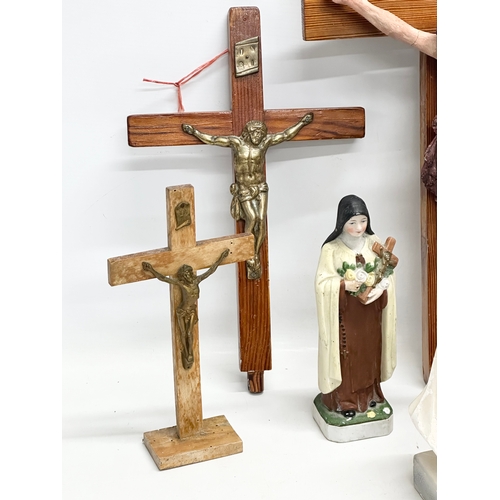 403 - A quantity of Early 20th Century tabletop and wall hanging crucifix’s. With later Madonna figures. P... 