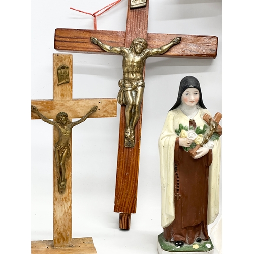 403 - A quantity of Early 20th Century tabletop and wall hanging crucifix’s. With later Madonna figures. P... 