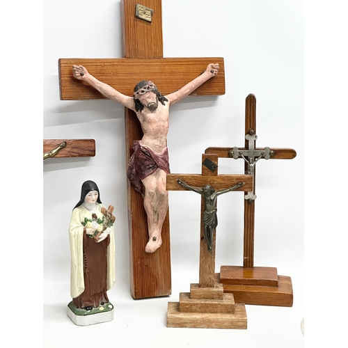 403 - A quantity of Early 20th Century tabletop and wall hanging crucifix’s. With later Madonna figures. P... 