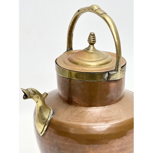 396 - An Early 20th Century Italian copper and brass water pitcher. 22x17x32cm