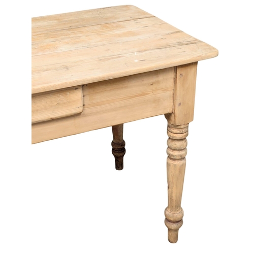 120 - A 19th Century Victorian pine farmhouse kitchen table with drawer on turned legs. 135x64x76cm