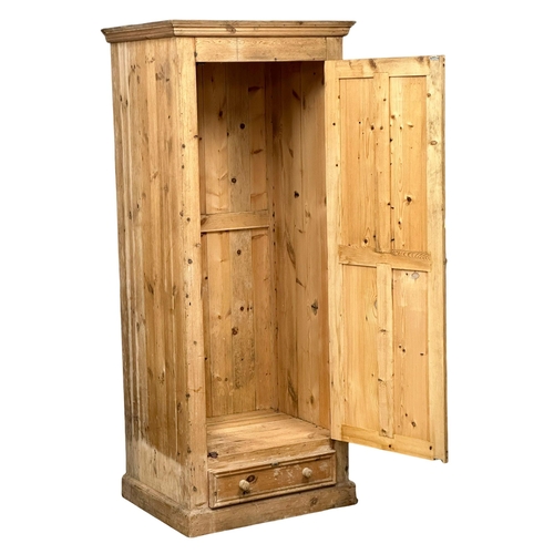 122 - A large Late 19th Century Victorian pine single door cupboard with drawer. 84x:68x204cm