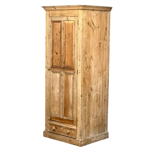 122 - A large Late 19th Century Victorian pine single door cupboard with drawer. 84x:68x204cm