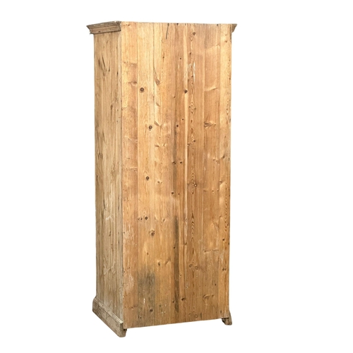 122 - A large Late 19th Century Victorian pine single door cupboard with drawer. 84x:68x204cm