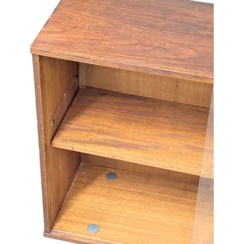 143 - A Mid Century teak bookcase by Avalon. 114x31x74.5cm