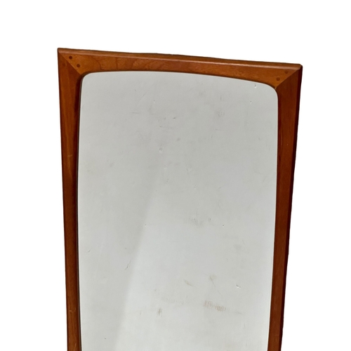 144 - Aksel Kjersgaard. A Danish Mid Century teak framed mirror. 47x100cm