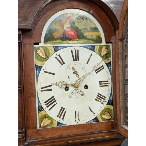 167 - A Late George III mahogany long case clock with painted dial on bracket feet. With weights and pendu... 