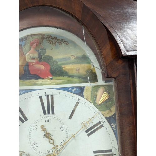 167 - A Late George III mahogany long case clock with painted dial on bracket feet. With weights and pendu... 