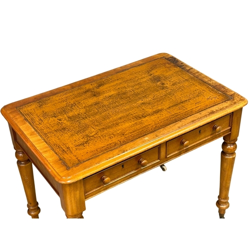 191 - A 19th Century Victorian 2 drawer writing table, with original leather top, turned legs on brass cup... 