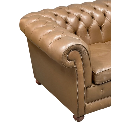 238 - A leather deep button back 3 seater sofa. 202cm