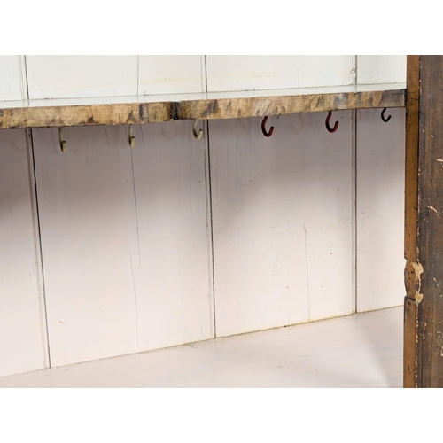 25 - A Mid 19th Century Irish pine kitchen cabinet in original scumble finish with fitted shaped shelves.... 