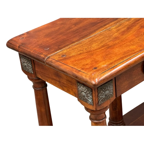 265 - An Early 19th Century style console table with 3 drawers, brass rosette mouldings and raised on bun ... 