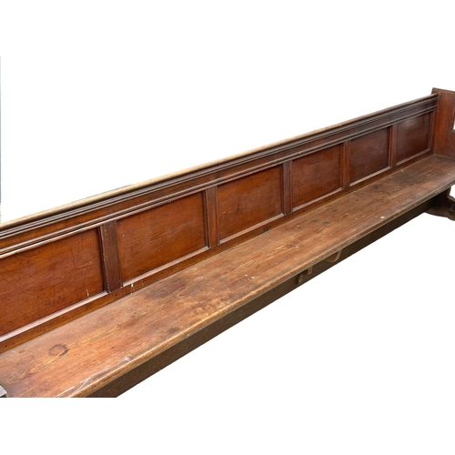 266 - A very large Late Victorian pitch pine church pew/bench. 356cm