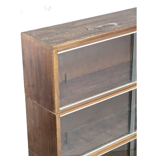 315 - A vintage stacking bookcase by Minty. 89x39x134cm