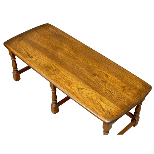 329 - An Ercol “Golden Dawn” coffee table with 2 nesting side tables. 114x50x41cm