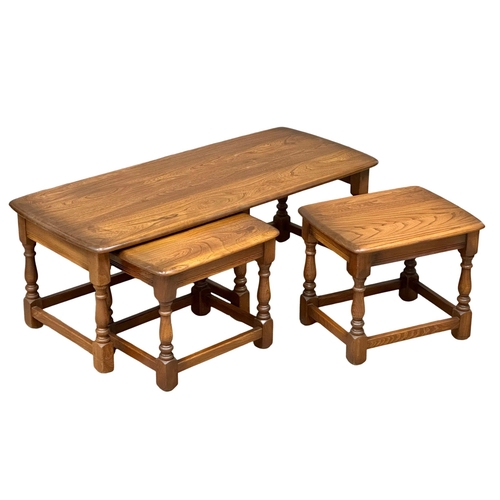 329 - An Ercol “Golden Dawn” coffee table with 2 nesting side tables. 114x50x41cm