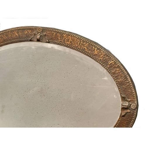 408 - An Arts & Crafts copper framed mirror. Circa 1900. 88x62cm