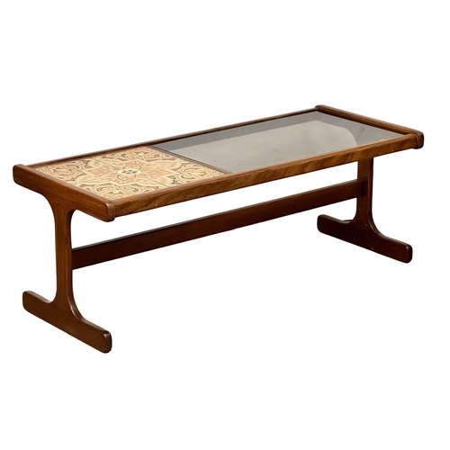 501 - A G-Plan Mid Century teak coffee table, with tiled and smoked glass top. 121x50x45cm