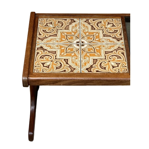 501 - A G-Plan Mid Century teak coffee table, with tiled and smoked glass top. 121x50x45cm