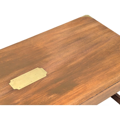 515 - A vintage mahogany campaign style coffee table with brass mounts. 107x46x44cm