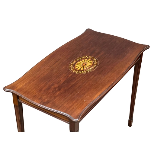 552 - An Edwardian inlaid mahogany side table on squared tapering legs. 90x49x70.5cm