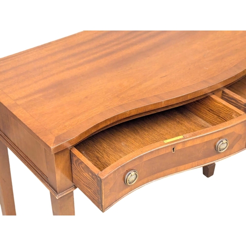 555 - A Hepplewhite style mahogany hall table with serpentine front on square tapering legs. 99x47x86cm