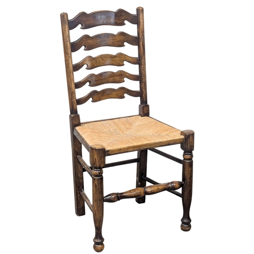 569 - A set of 8 Early 19th Century style dining chairs with ladder back and rushed seats