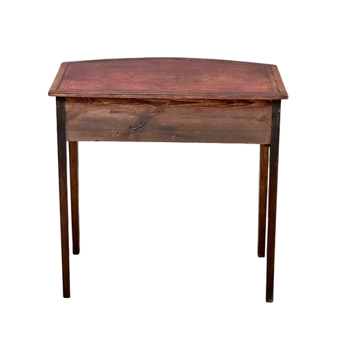 57 - A Late 18th Century George III mahogany bow front writing table with leather top on square tapering ... 