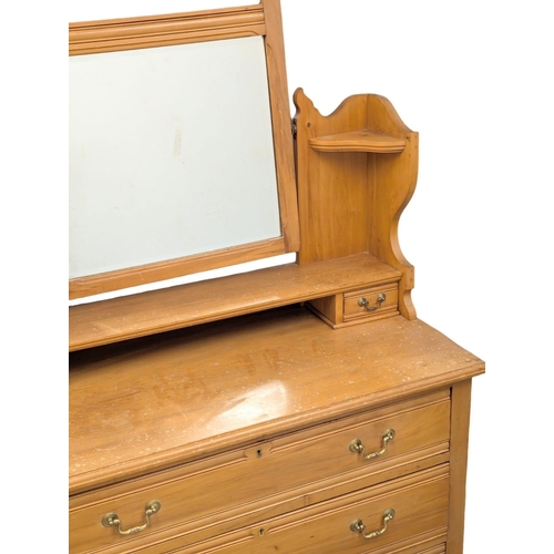 824 - An Edwardian satin walnut dressing table. 106x47x159cm