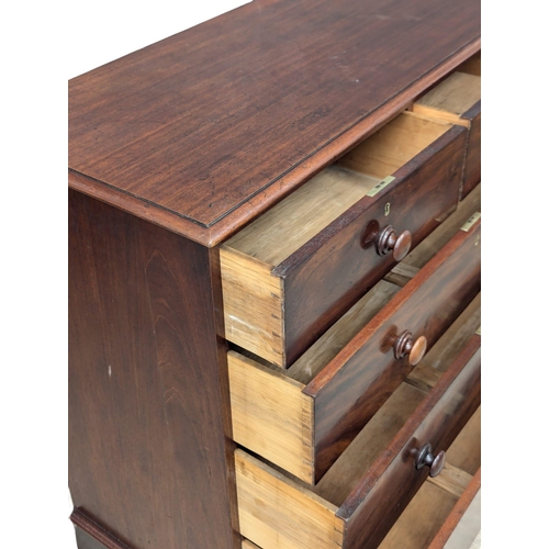 97 - A 19th Century Victorian mahogany chest of drawers with bun handles on splayed feet. 110x51x113cm