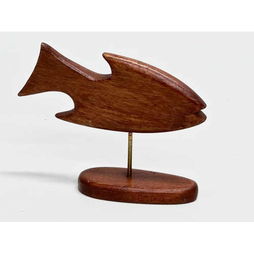 147 - A Scandinavian Mid Century teak fish sculpture. 14.5x11.5cm