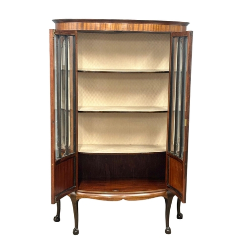 323 - A large Edwardian mahogany bow front display cabinet, with astragal glazed doors and ball on claw fe... 