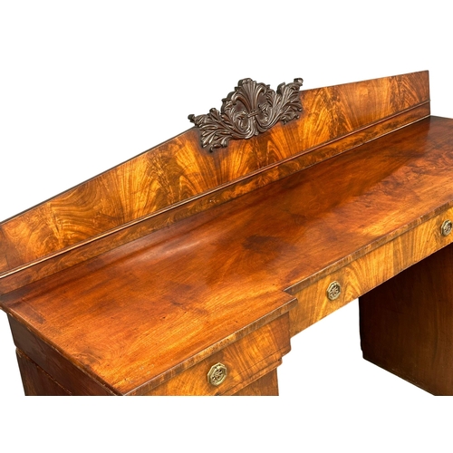 399 - A William IV mahogany pedestal sideboard. With Prince of Wales Feathers. Circa 1830. 198x64x134cm.