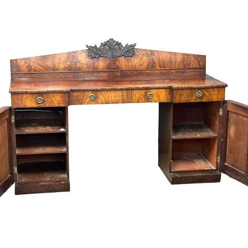 399 - A William IV mahogany pedestal sideboard. With Prince of Wales Feathers. Circa 1830. 198x64x134cm.