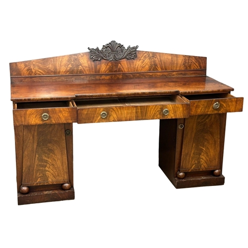 399 - A William IV mahogany pedestal sideboard. With Prince of Wales Feathers. Circa 1830. 198x64x134cm.