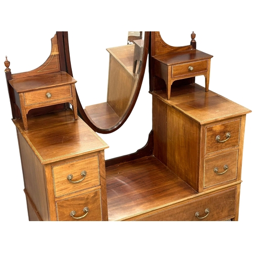 833 - A large Edwardian inlaid mahogany dressing table. 122x58x200cm