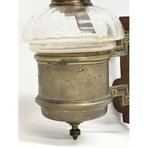 461 - A Late 19th Century Victorian wall hanging oil lamp. In the aesthetic movement. 23x32cm