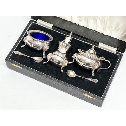 844 - A B.H. LTD silver plated cruet set in case, with Bristol Blue liners. 27x14x9.5cm