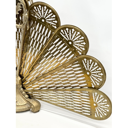 717 - A vintage brass peacock firescreen.