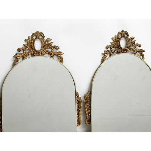 474 - A pair of vintage brass framed mirrors. 36x66cm