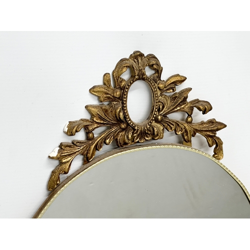 474 - A pair of vintage brass framed mirrors. 36x66cm