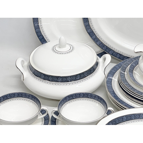 997 - A 36 piece Royal Doulton “Sherbrooke” dinner service. A platter. 6 dinner plates. 2 tureens. Serving... 